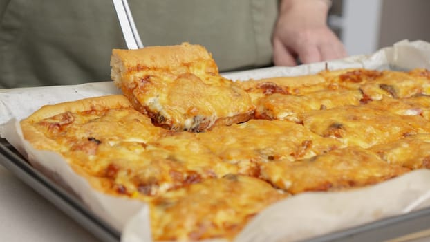Homemade square pizza with cheese and sausage topping served on wooden table Square pizza, full cheese spread organic pizza healthy pizza.