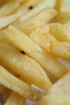 Crispy potato strips are served hot, ready to be enjoyed as a snack.