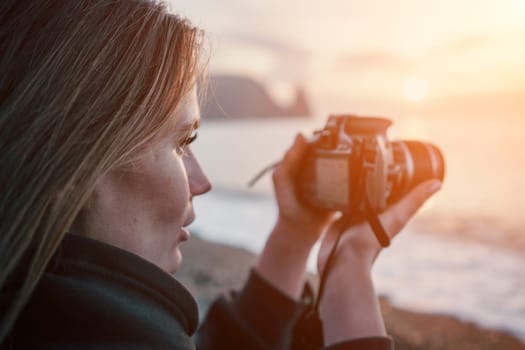 Woman travel sea. Happy tourist taking picture outdoors for memories. Woman traveler looks at the edge of the cliff on the sea bay of mountains, sharing travel adventure journey.