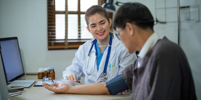 doctor discussion results or symptoms and gives a recommendation to a senior male patient, giving consultation during medical examination in clinic.