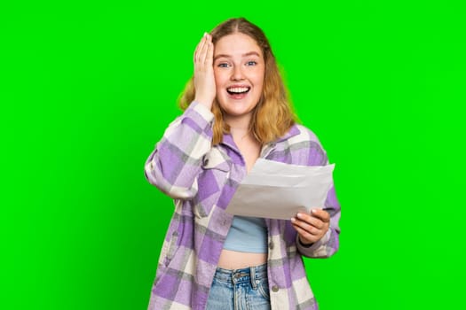 Young woman opens envelope take out letter reads it feel happy. Career growth advance promotion, bank loan approve, monetary award, long-awaited invitation great news. Redhead adult girl on chroma key