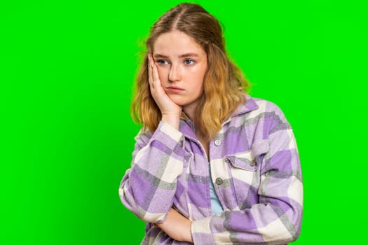 Young Caucasian woman tired bored indifferent expression, exhausted of tedious story, not interested in communication talk, displeasure, uninteresting. Girl isolated on chroma key background indoors