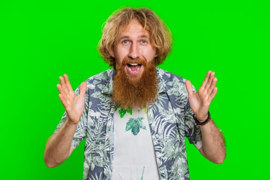 Oh my God, Wow. Excited amazed winner man raising hands in surprise looking at camera with big eyes, shocked by sudden victory celebrating success achievemen good news. Guy on chroma key background