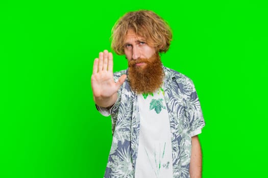 Stop, enough. Caucasian man say no hold palm folded crossed hands in finish gesture, warning of finish, prohibited access, declining communication body language danger. Guy on chroma key background