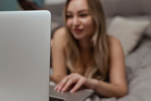 A beautiful, young girl shoots a webcam, works as a model. The concept of online flirting, sex on the Internet.