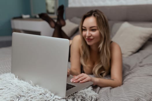 A beautiful, young girl shoots a webcam, works as a model. The concept of online flirting, sex on the Internet.