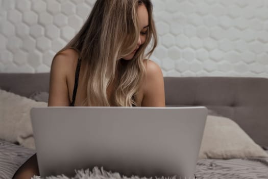 A beautiful, young girl shoots a webcam, works as a model. The concept of online flirting, sex on the Internet.