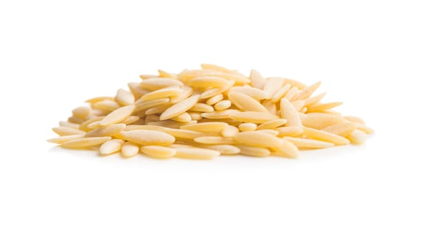 Orzo, kritharaki, risoni pasta. Uncooked dry pasta isolated on a white background.