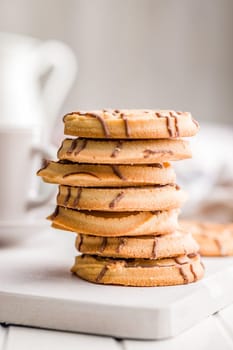 Sweet chocolate cookies on a white table.