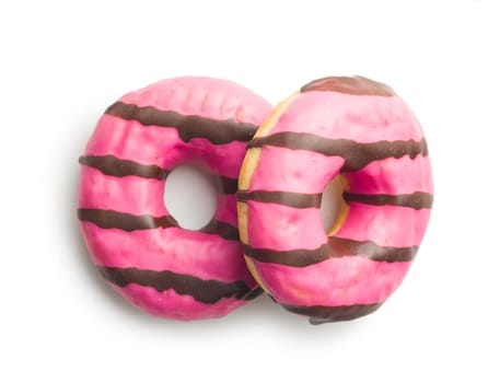 Sweet pink donut with chocolate strips isolated on a white background.
