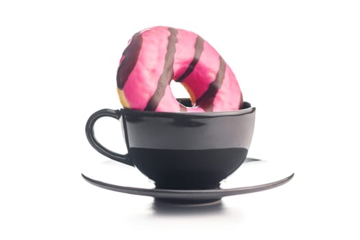 Sweet pink donut with chocolate strips and coffee cup isolated on a white background.