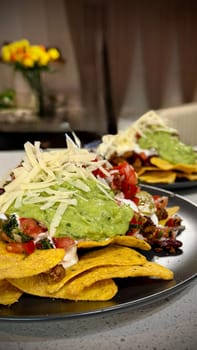 Beef nachos with multiple toppings. High quality photo