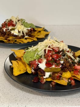 Beef nachos with multiple toppings. High quality photo