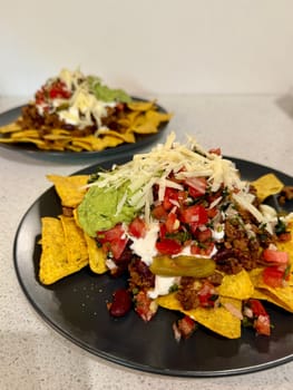 Beef nachos with multiple toppings. High quality photo