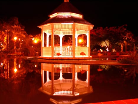 Pavilion at night in the Caribbean with flamingos