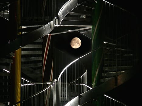 The rising moon seen by a stair construction in HH-Neuallermöhe