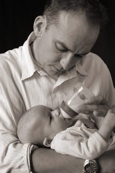 Father breastfeeding daughter