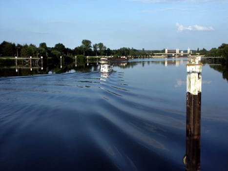 Elbe barge and yacht at the Elbe lock near Geesthacht