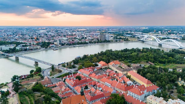 Aerial view of Novi Sad Serbia with Petrovaradin fortress and Danube river during sunset