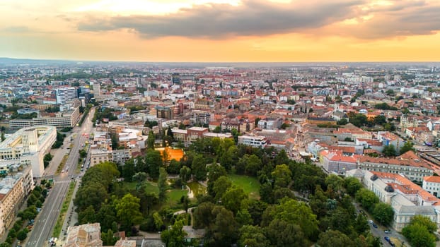 Aerial view of Novi Sad Serbia with green park urban cityscape and sunset sky