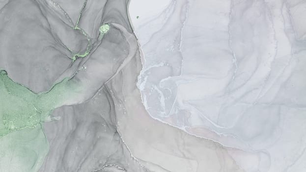 An abstract composition created using alcohol ink showcases soft gray and green hues blending together, revealing fluid shapes and organic patterns that evoke tranquility and creativity.