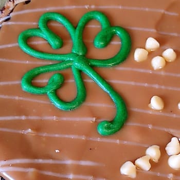 Green clover cookie cream food dessert tort clever Ireland simbol holiday chocolate. High quality photo