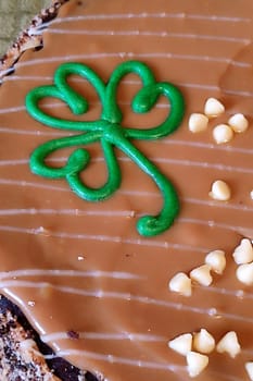 Green clover cookie cream food dessert tort clever Ireland simbol holiday chocolate. High quality photo