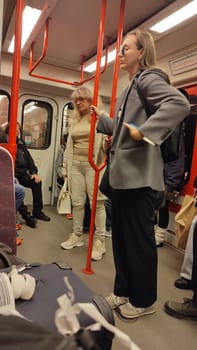October 15 2024 Prague Czech Republic Europe, Subway passengers standing people travel yang girls boy , transport metro editorial . High quality photo