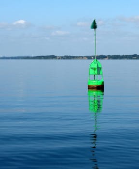 This buoy floats on the starboard side (right) of the fairway.  -)