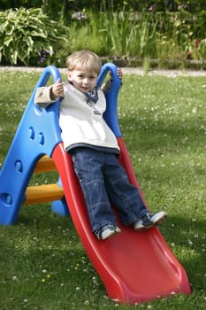 Boy playing with the slide