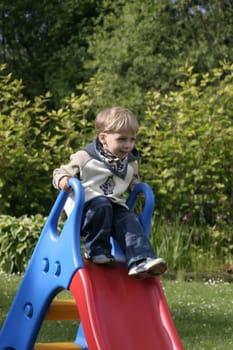 Boy playing with the slide