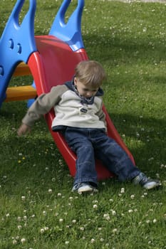 Boy playing with the slide