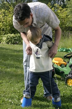 Father and son doing an exercise in skill