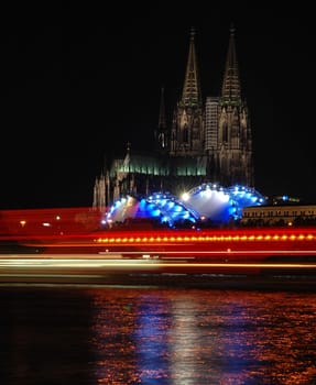 Recorded during the "Kölner Lichter"" in June 2004 in front of the large fireworks. The light strips on the Rhine come from passing ships. Nikon D70,18-70."