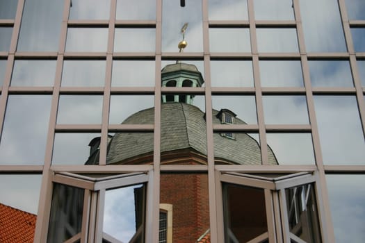 Reflection of a dome in a department store façade in Münster (Westphalia).