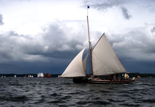 Storm is approaching and the classic cars are getting off to a good start. Rum Regatta 2004 on Flensburg Fjord