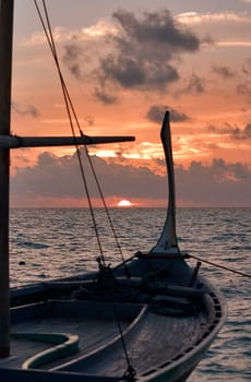 Dhoni at sunset,Maldives