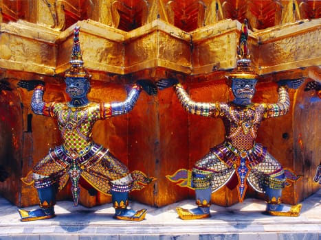 Terrifying temple guards prop up a "chedi"" at Wat Phra Kaeo in Bankok. Rama I had the temple complex built to commemorate the destroyed royal city of Ayutthaya. (Data up to poster size available)"