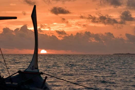 Dhoni at sunset,Maldives
