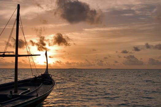Dhoni at sunset,Maldives