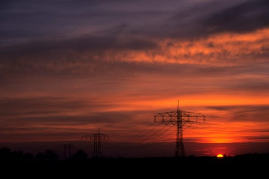 High-voltage current in the evening light
