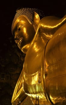 The famous "Reclining Buddha"" is 46 m long and,with a height of almost 15 m,fills the entire interior of the building at the northwest corner of the temple grounds. It is covered with several layers of gold leaf and has magnificent mother-of-pearl inlays"