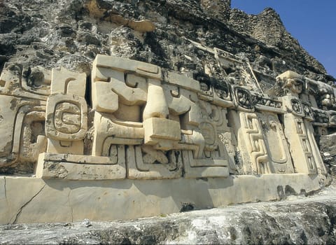 Exposed stucco cladding on a Mayan pyramid in Xunantunich.