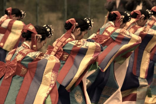 Dancers in the traditional dress of the concubines at the imperial court. Concubines were also supposed to entertain the imperial family. As here,they have to bow humbly to the emperor.