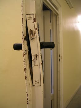 Broken door of a music practice room.