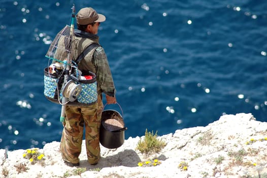 Fisherman on the cliff