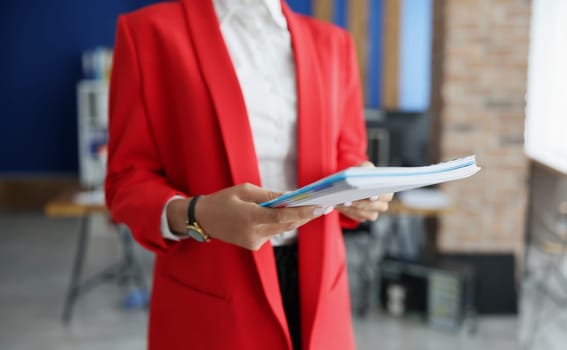 Female hands hold folder with financial documents. Small and medium business development concept