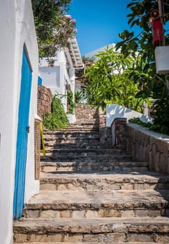 A set of stone steps leading up to a building. Photo of stone steps leading up to a beautiful building in Sicily, Italy