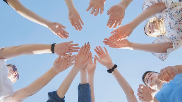 Seven boys and girls join hands as a sign of strong friendship