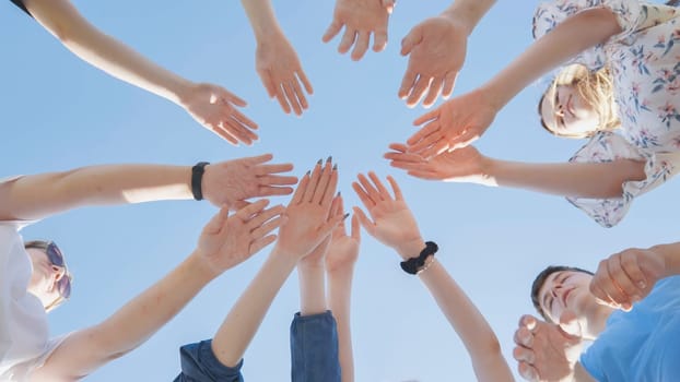 Seven boys and girls join hands as a sign of strong friendship